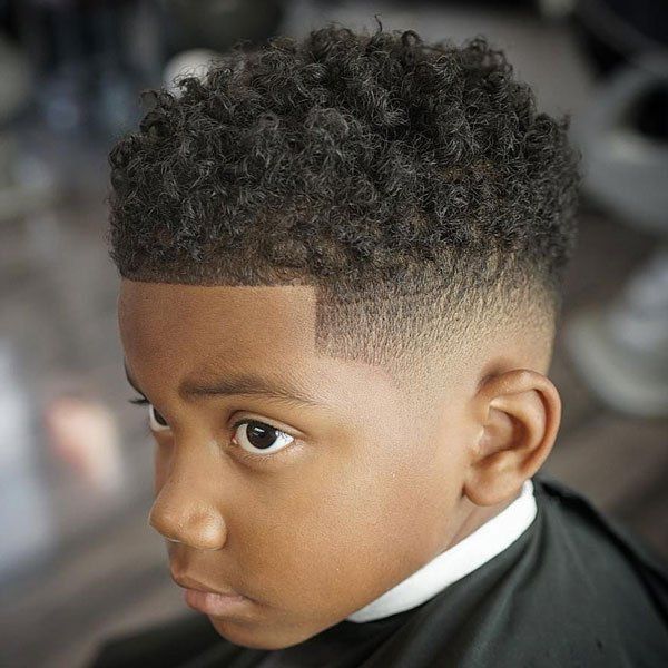 A black  kid with a Fade Cut