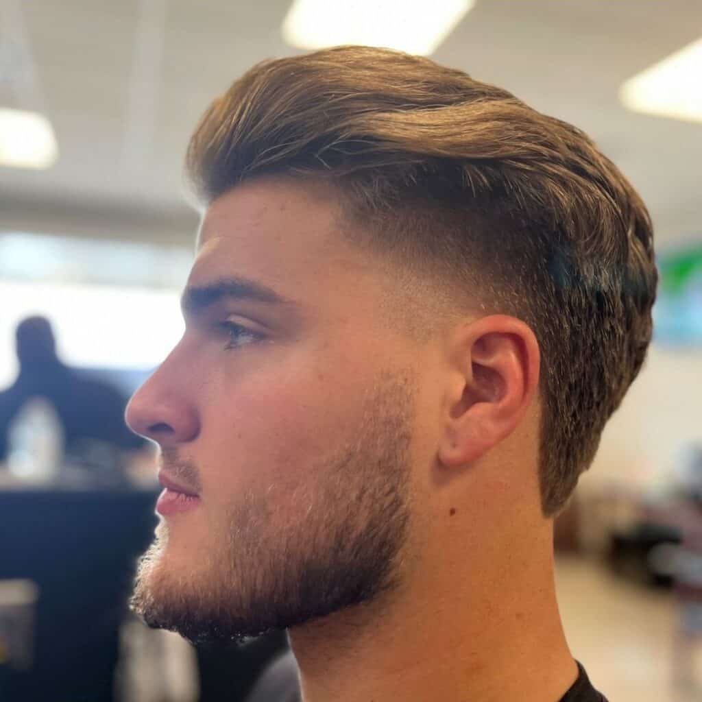 A man with a Low Taper Fade haircut