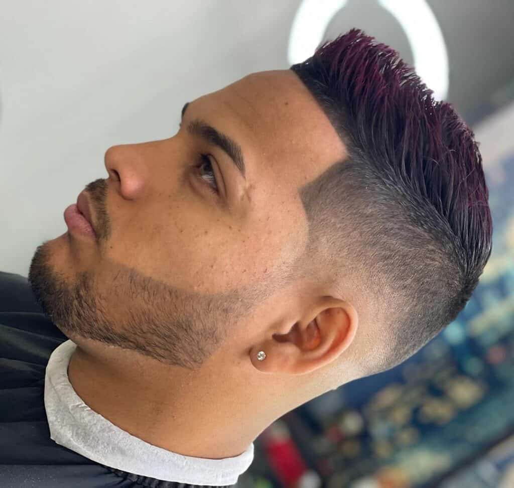 A man with a Medium Low Fade haircut