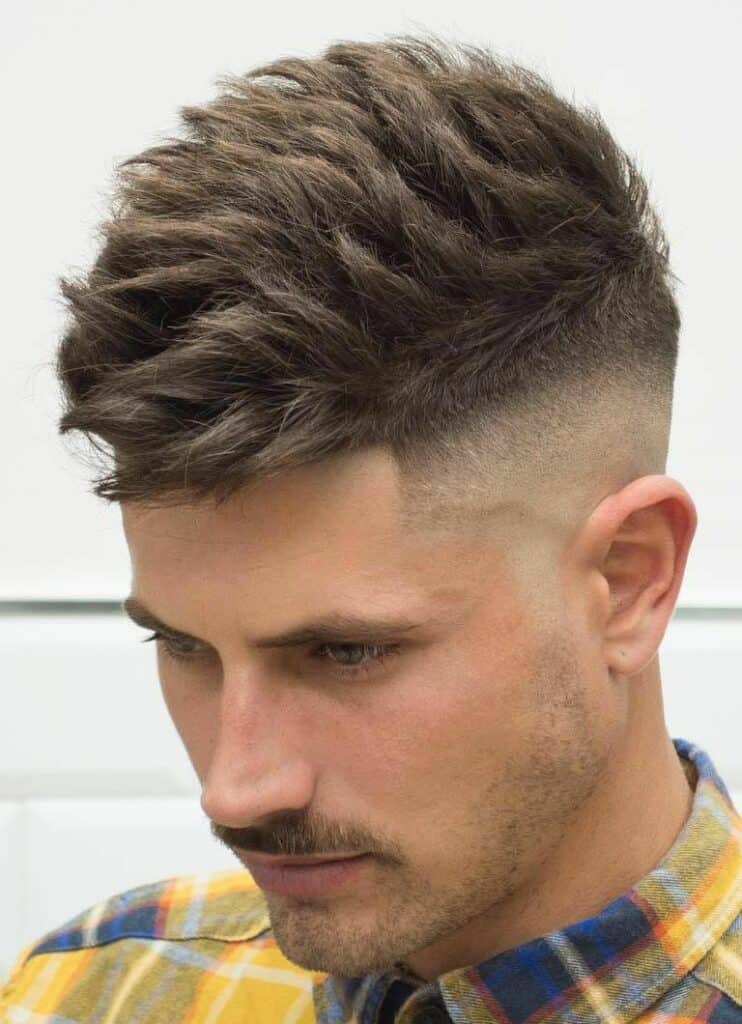 A young man with a Textured Fade Cut