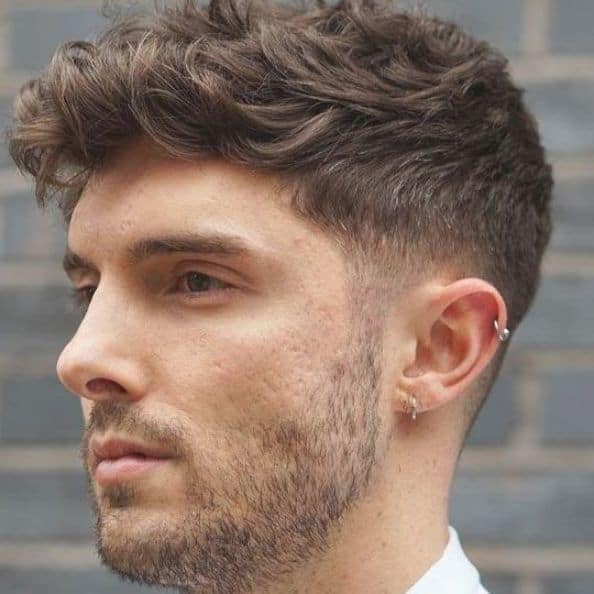 A Young Man with a Wavy Fade Haircut