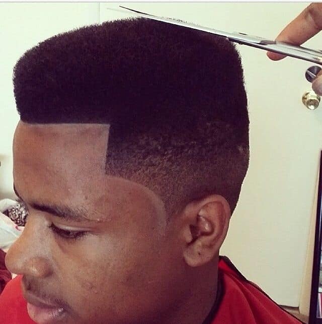 barber making fade cut
